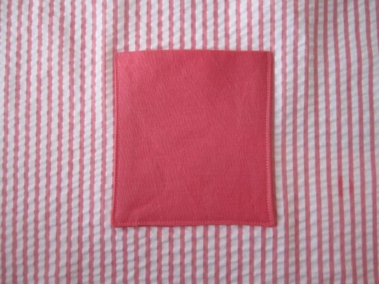 Topstitch the pocket in place